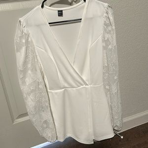 White romper with knitted sleeves